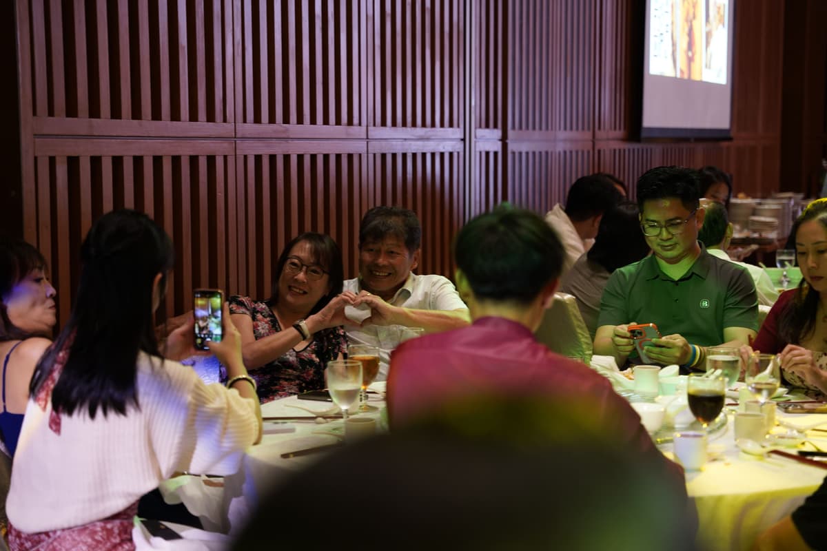 Wedding guests sharing a candid table moment